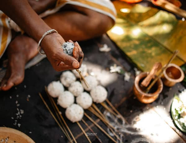 Preparing pinda offerings during a ritual